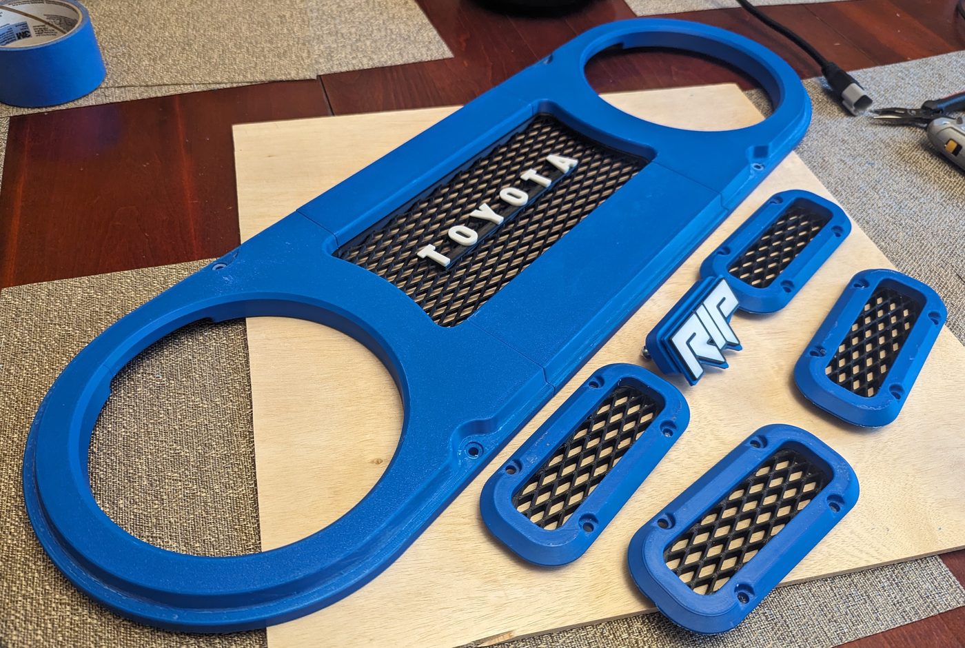 3D printed grill components laid out